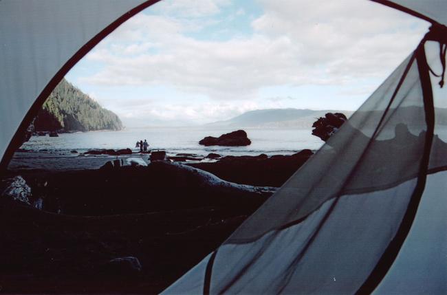 Thrasher cove campsite. We've arrived after a very long day of muddy and steep ascents and descents. The trail was tricky. Each foot had to be placed with careful navigation and observation. Wet slippery roots, steep water-slicked surfaces and mud - thick deep mud surrounded us. But we're here now and we're blissed! The sound of the ocean gently caresses the sand less than one foot from our tent door. The sound and smell of nature's intoxication is truly heaven on Earth.