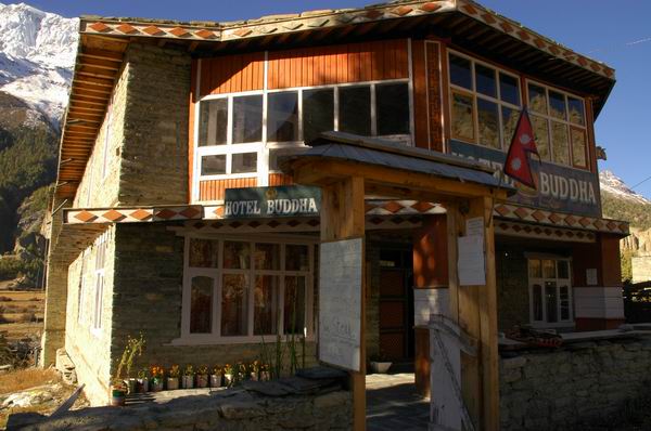 The Hotel Buddha. This was one of our favourite hotels on the trek. We have our own private on-suite Turkish style toilet. There were hot showers, an outdoor sun soaked patio overlooking a beautiful view of Annapurna III and Gangapurna and a warm and cozy fire-place room to enjoy with other trekkers.