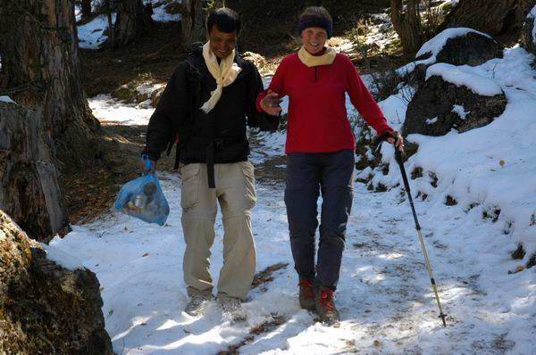 Lauri and our porter, Manooj coming down the steep and snowy sections of the trail from Milarepa gompa.