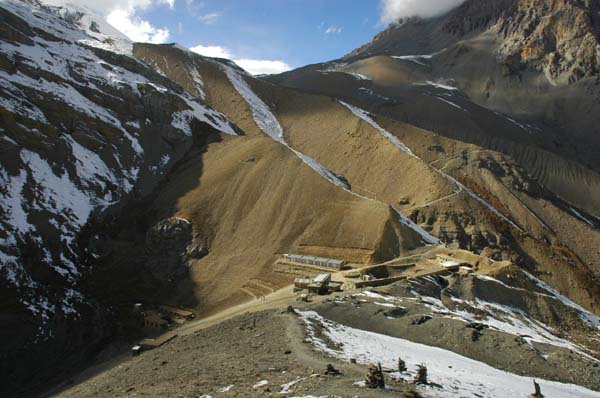 From the top of the hill we can see the start of our trail (on the right side of photo) to the Thorung La pass which we will take the next morning at 4:30 am. Our lodge is just below. It begins to snow shortly after we return back to our lodge; the date is October 25th - exactly two months before Christmas, making it a cold but magical experience for us.
