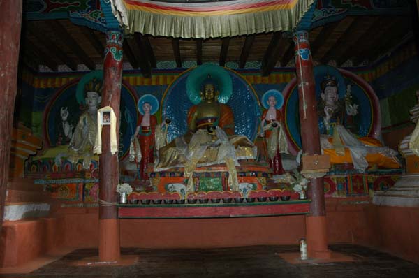 Inside temple are lovely statues of the Buddha