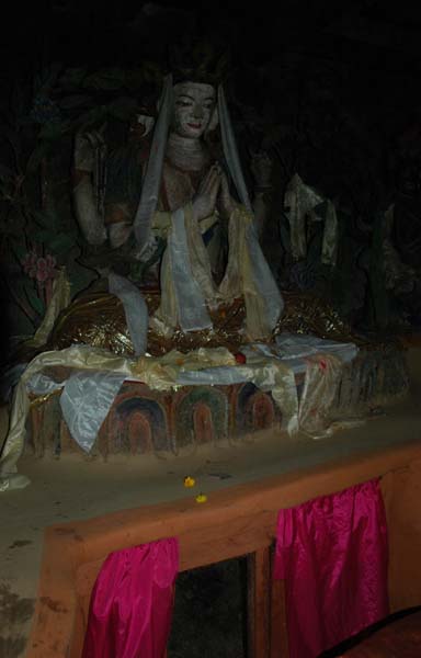The sacred fire and spring can by viewed from the little window below the Buddha statue