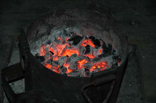 ... this is why. The coal fire is placed under the table, constantly refilled with hot coals by our energetic hosts.