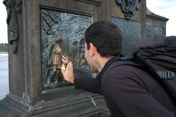 Locals (and tourists) touch the shiny spot on the base of the statue to help their wishes come true.