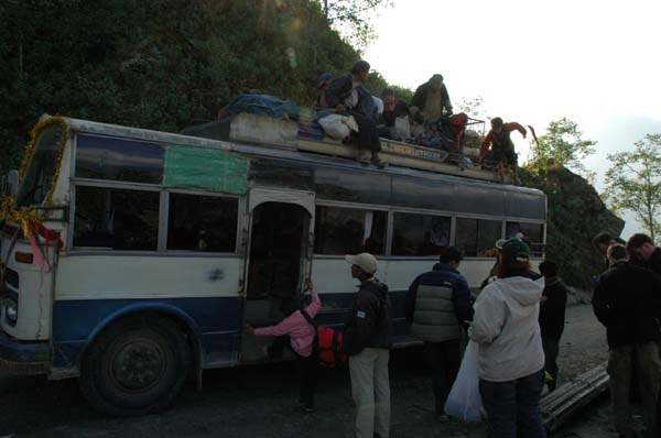 Time to take the gravol and jump on the bus. Our trekking bag will ride on the top with a number of other passengers who can't fit in the bus.