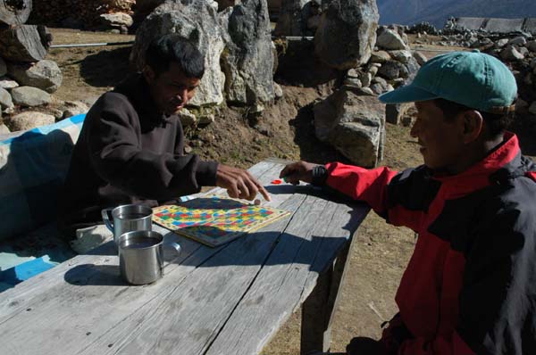The favourite pastime - Dawa and Manoj playing Snakes and Ladders