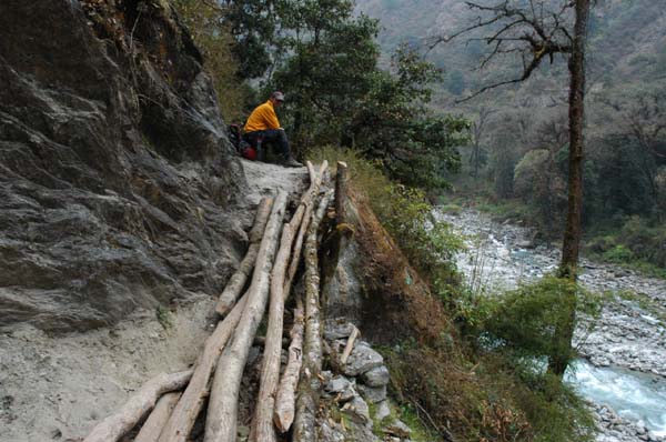 Look carefully, we must cross this so-called bridge as the trail has eroded away below it