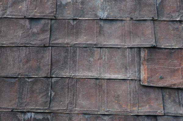 The roof of the house in the previous photo. It appears to be made from crushed cooking oil cans.