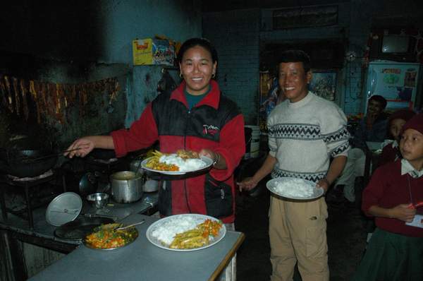 Tsering (Dawa's wife) and Dawa serving us a scrumptious lunch at their tea house