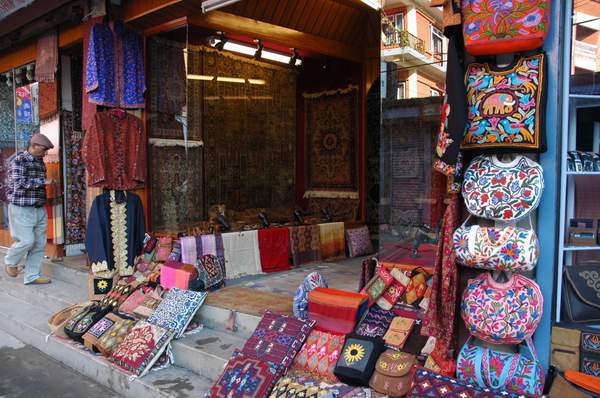 On the streets, you'll all many kinds of shops. This is one of our favourite, a Kashmiri fabric arts store.