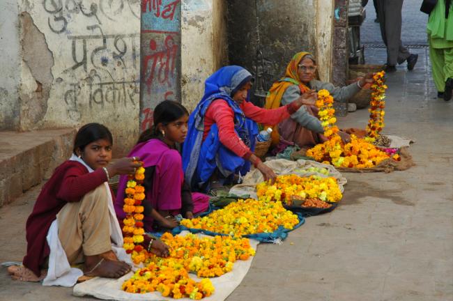Colourful and sweet smelling garlands for sale, purchased for offering to the temple dieties.