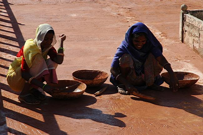A mixture of dirt, water and cow dung is often applied to the floor (by the women). It becomes a hard surface to walk on once dry.