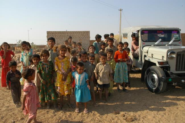 A following of children collect around us during our village visit at the start of our camel safari near Jaisalmer.