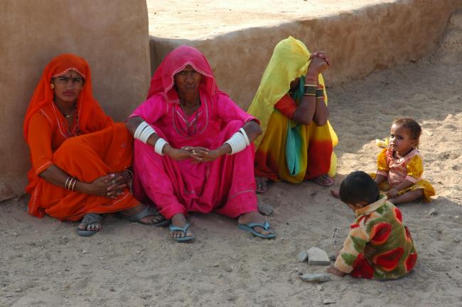 Colourful townwomen and children warmly welcome us with their bright smiles.