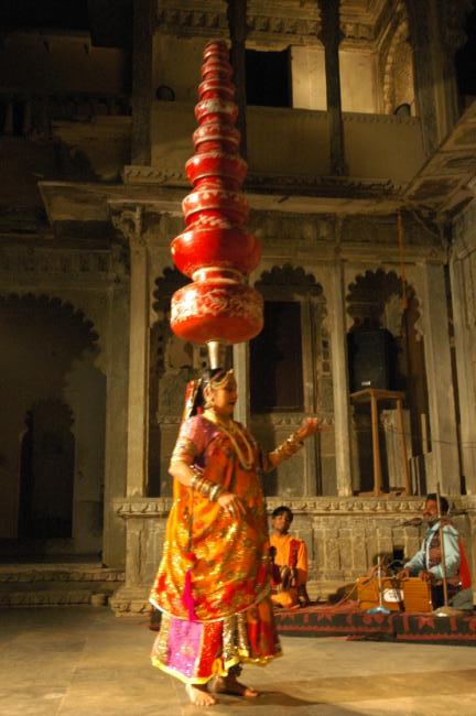 At the same time she dances on glasses, swords, broken glass and other various objects, all while maintaining her perfect balance.